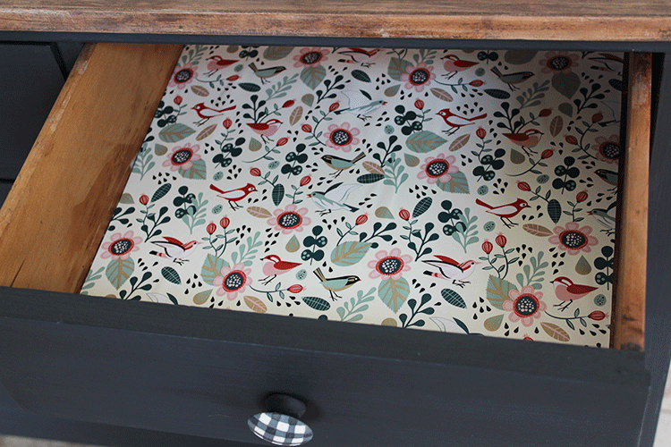 pretty floral and birds paper in the dresser drawers