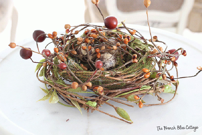 faux bird's nest with fall berries