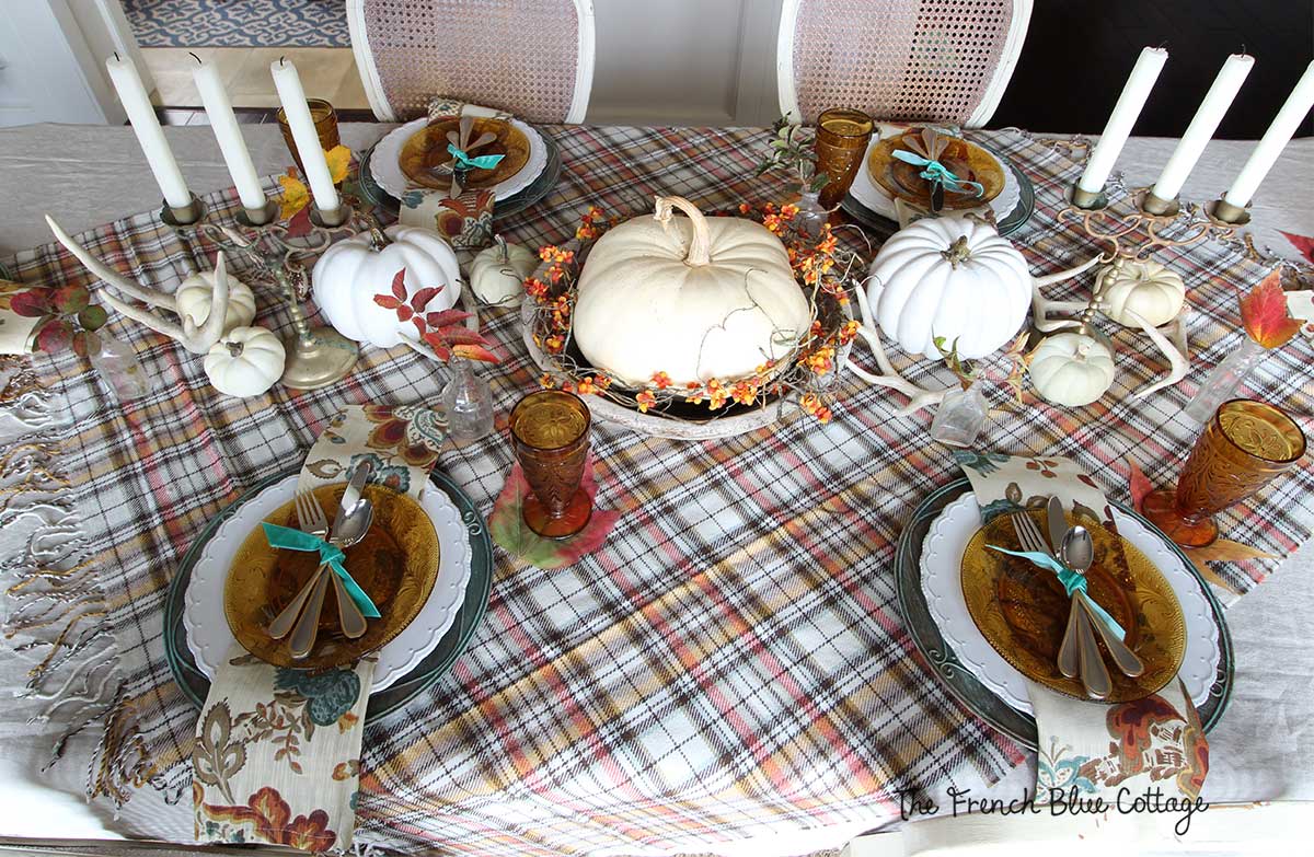 Fall tablescape with a plaid throw.