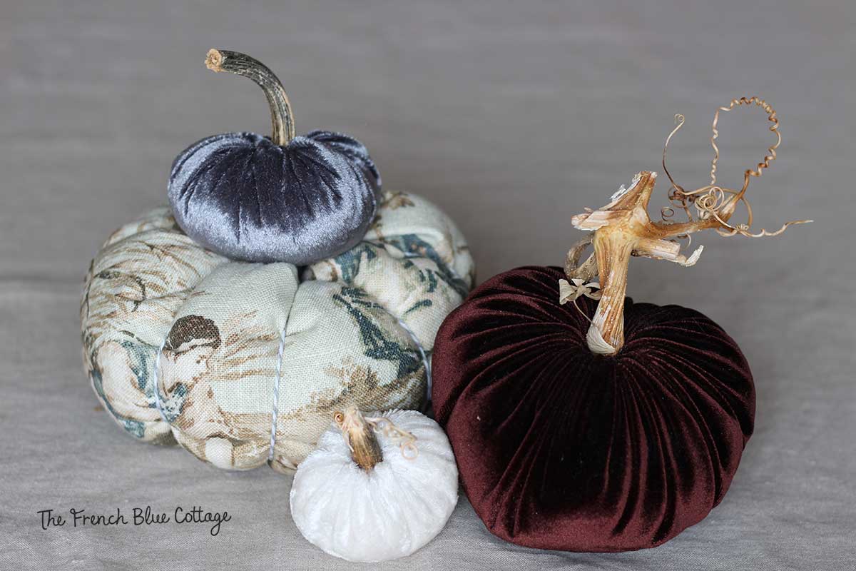 Velvet and fabric pumpkins with real stems.