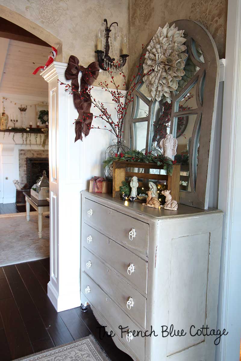 French country entry table decked out for Christmas. 