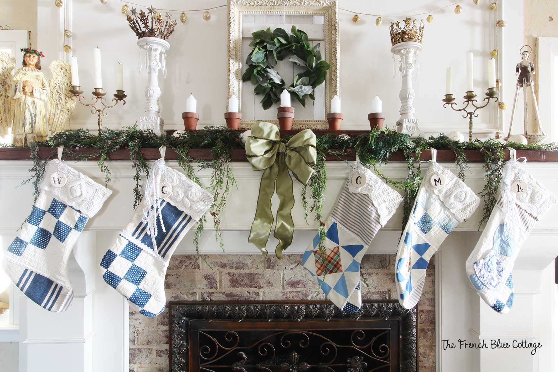 Patchwork stockings on a French country Christmas mantel.