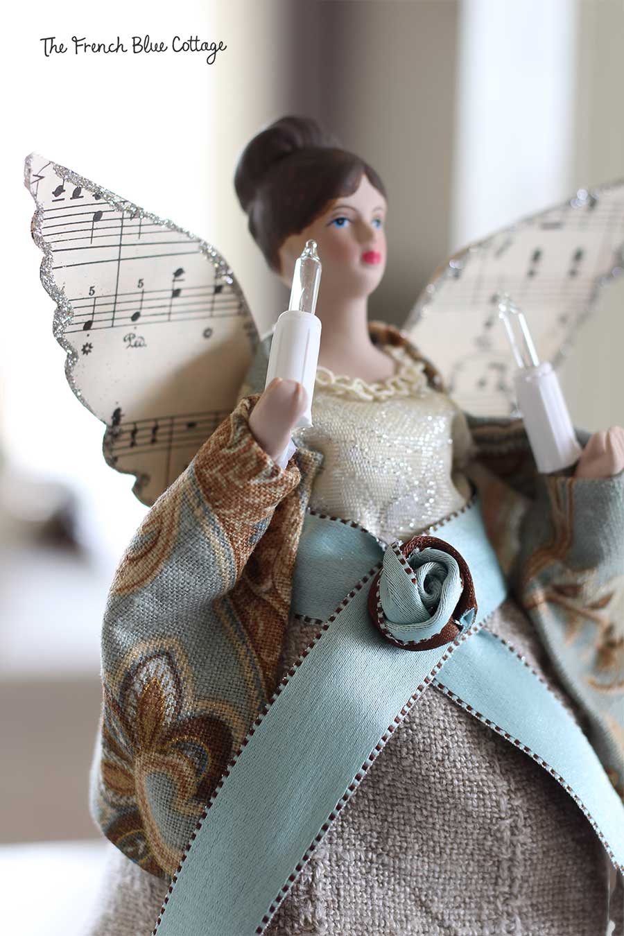 Tree angel makeover with sheet music glitter wings.