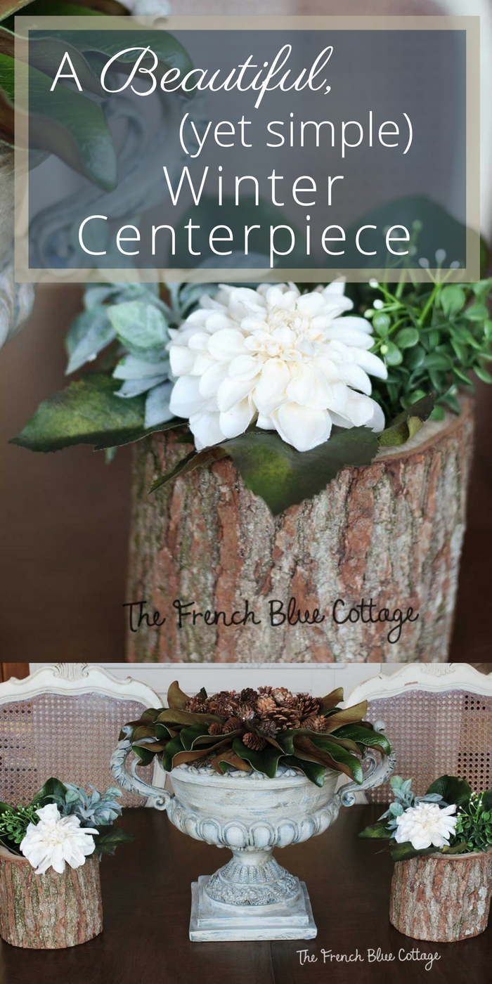 a simple winter tablescape centerpiece with magnolia and pinecones