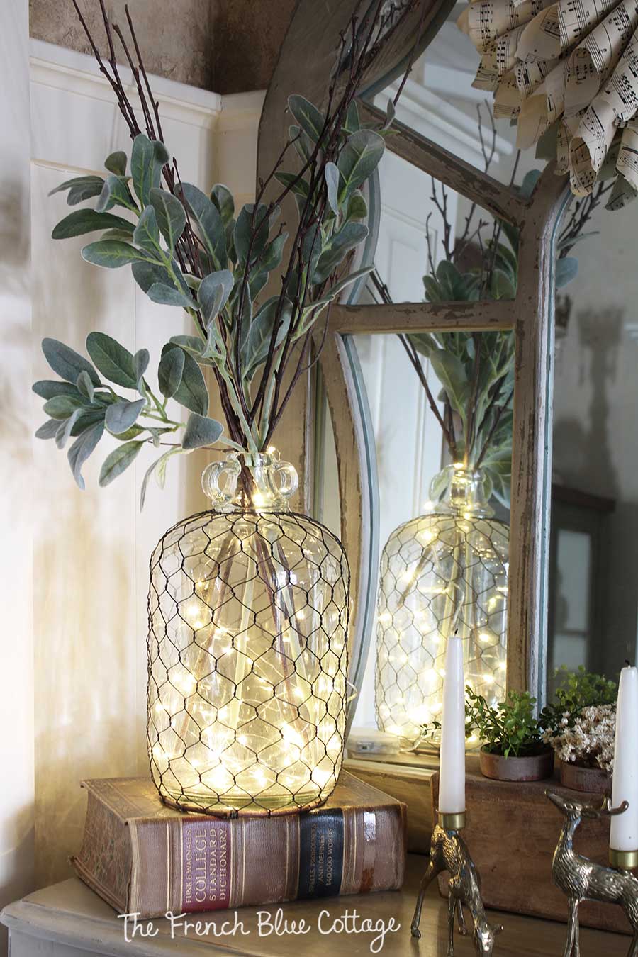 Winter vignette with fairy lights in a jar with remote.