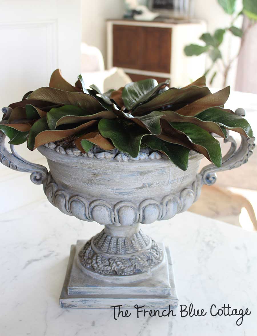 Magnolia leaves in an urn for winter.