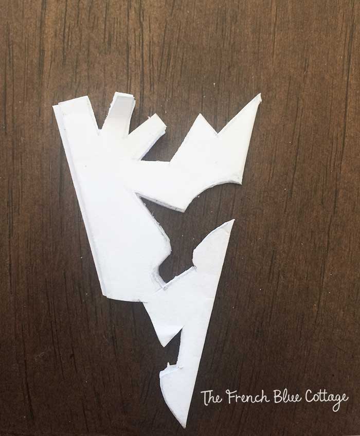 Paper snowflake with pattern cut out.