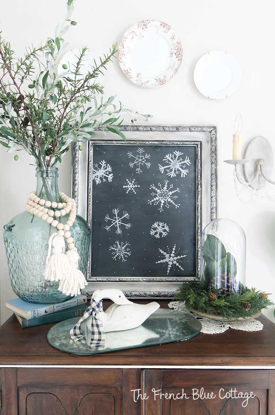 Winter vignette with wood beads and chalkboard snowflakes.