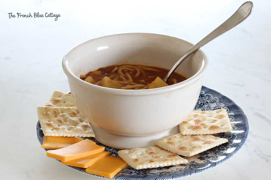 Grandmama's soup or stew with crackers and cheese.