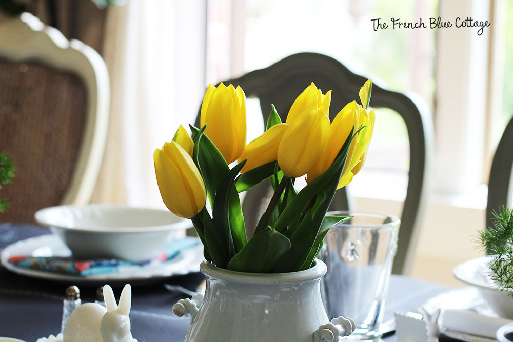 Bright yellow tulips are the centerpiece on the Easter table.