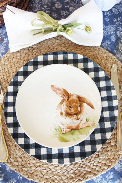 Bunny and gingham plates with a woven placemat place setting.