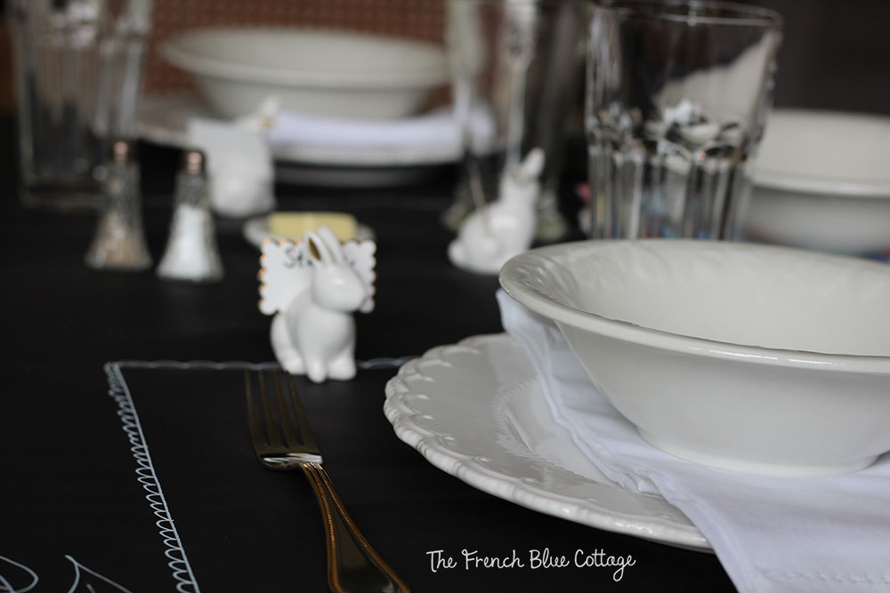 Lay black paper as a tablecloth and draw fancy placemats around your dishes with a white chalk pen.