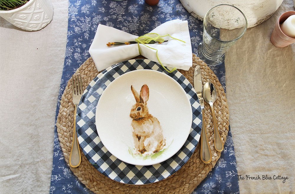 Bunny and gingham place setting with a woven placemat.