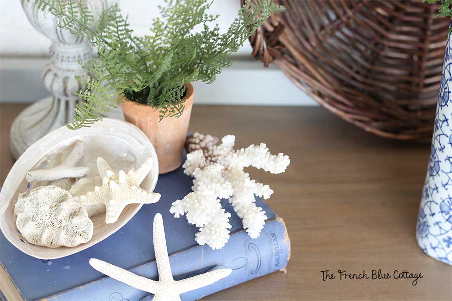 Seashell vignette on a vintage washstand.