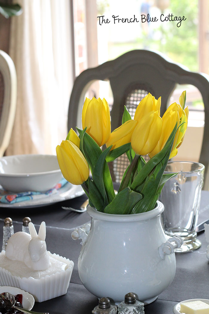 Yellow tulips in ironstone and a milk glass bunny make an easy Easter centerpiece.
