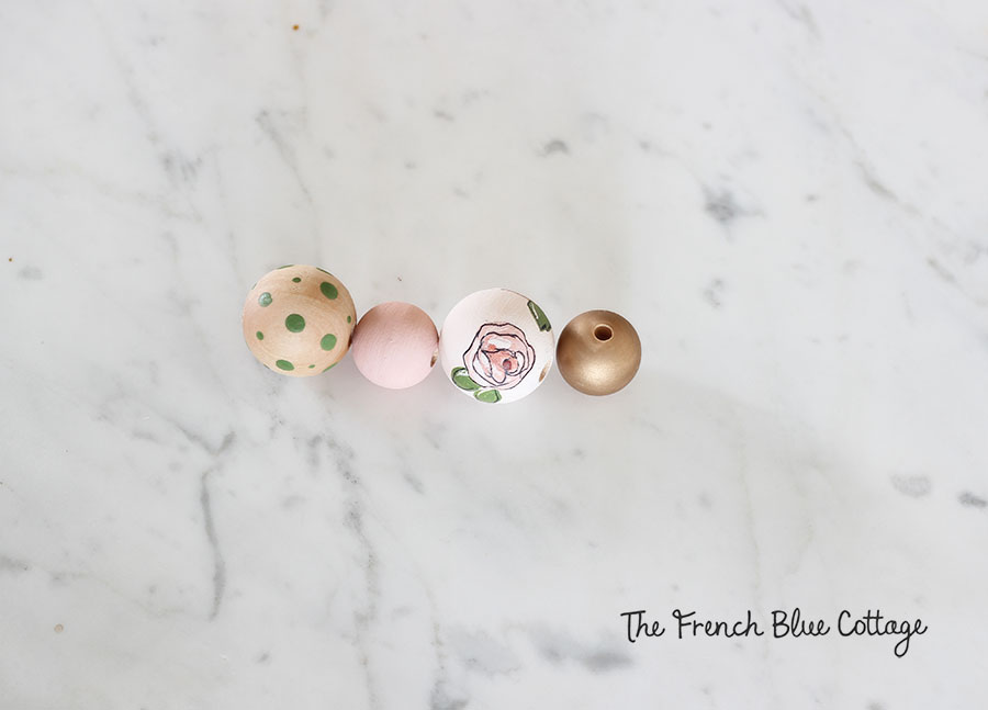Painted wood beads for a diy tassel keychain.