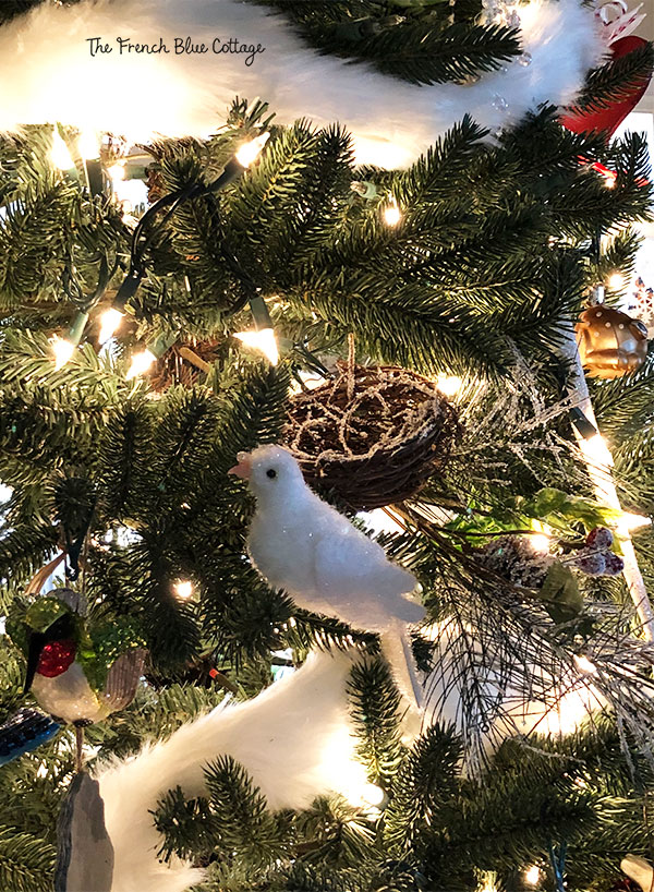 A white fur garland on the Christmas tree.