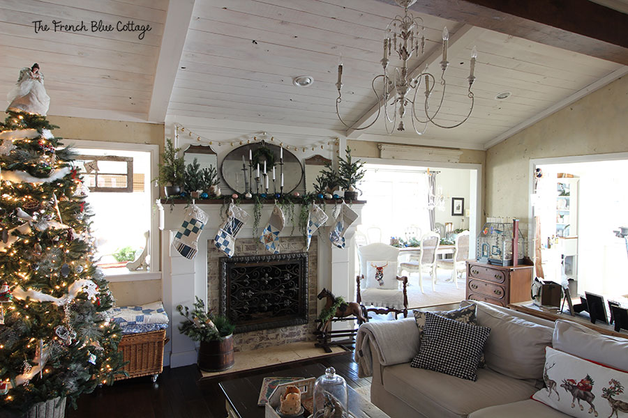 A rustic, elegant, French country living room dressed for Christmas.