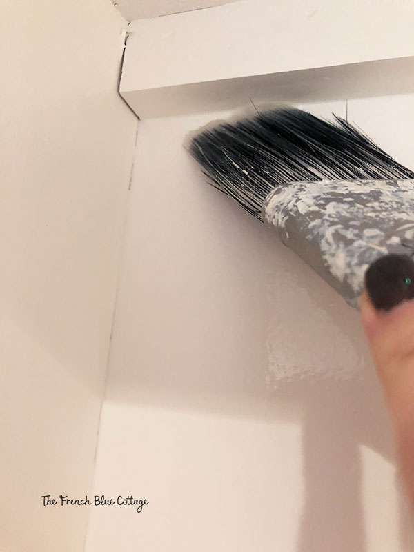 painting starch on bookshelf