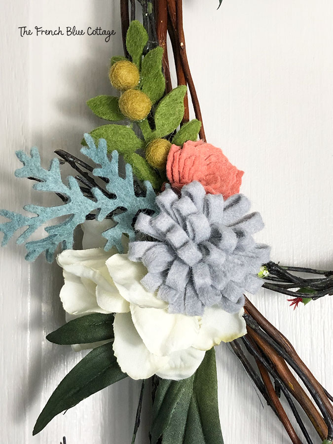 felt flowers on a twiggy stick letter