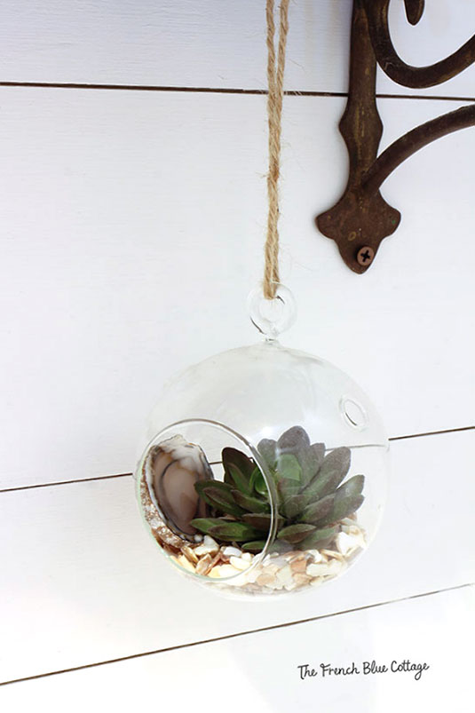 hanging terrarium with agate slice and succulent