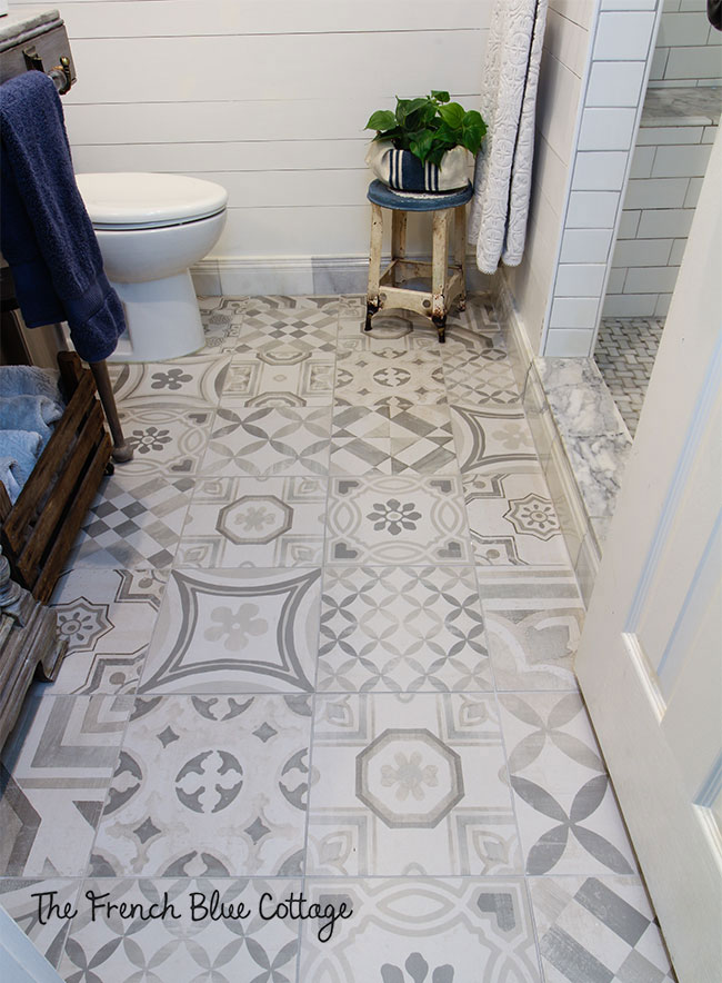 pathwork style tile floor in gray and white