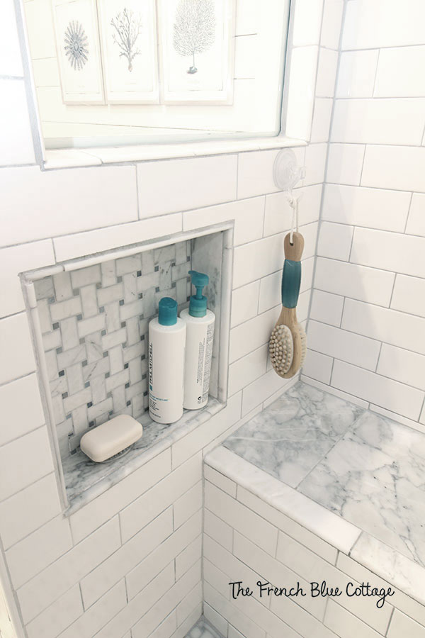built-in shower niche for shampoo bottles and soap