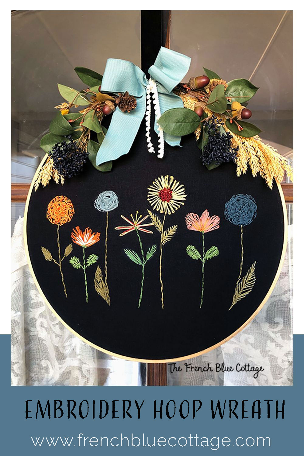 embroidery hoop wreath with diy embroidered flowers and a velvet bow