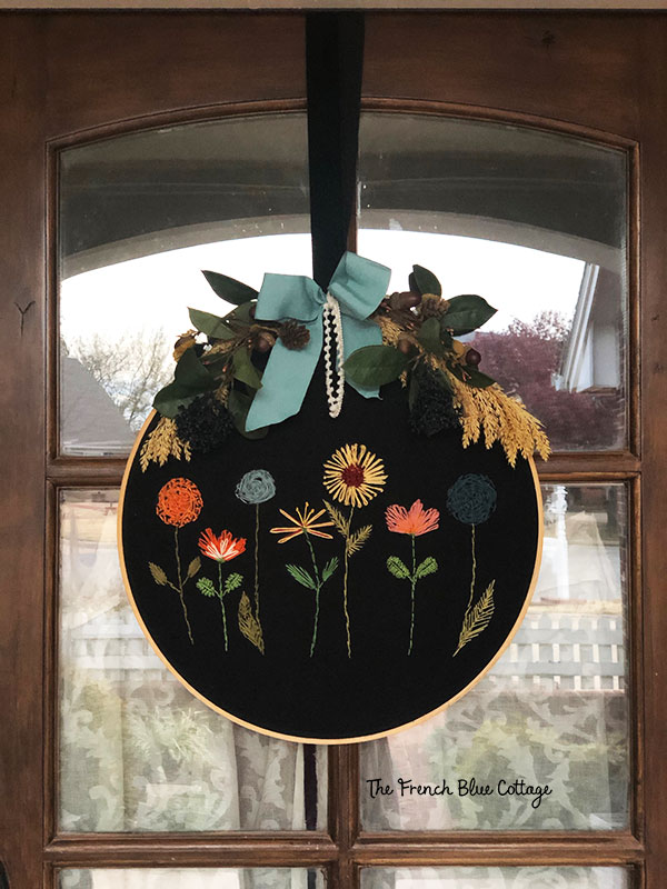 embroidery hoop wreath on a fall front porch