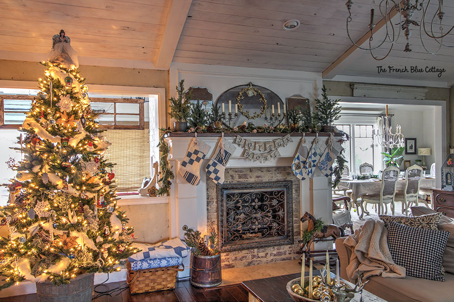 French country Christmas decor on mantel with quilted stockings