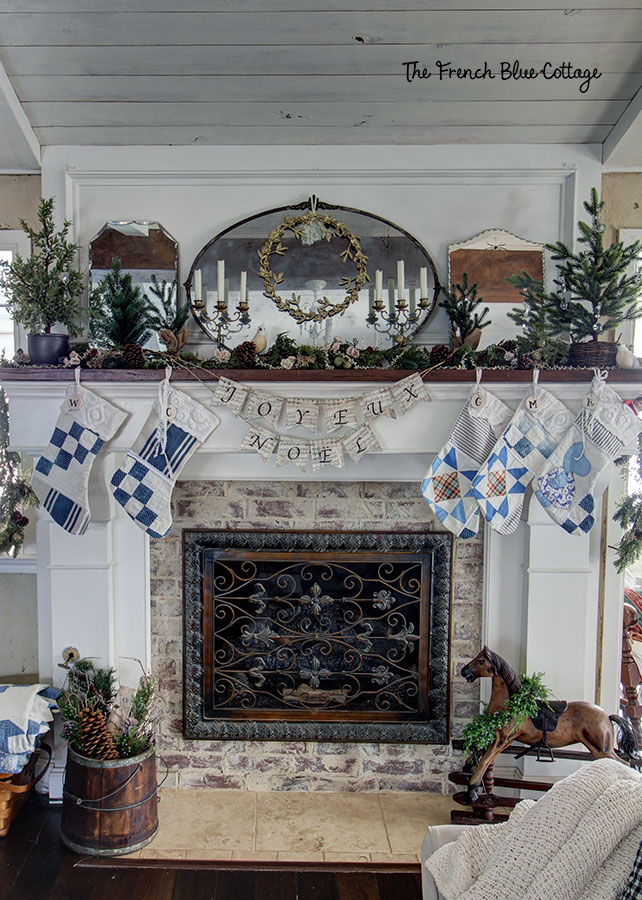 French country Christmas decor on mantel with quilted stockings