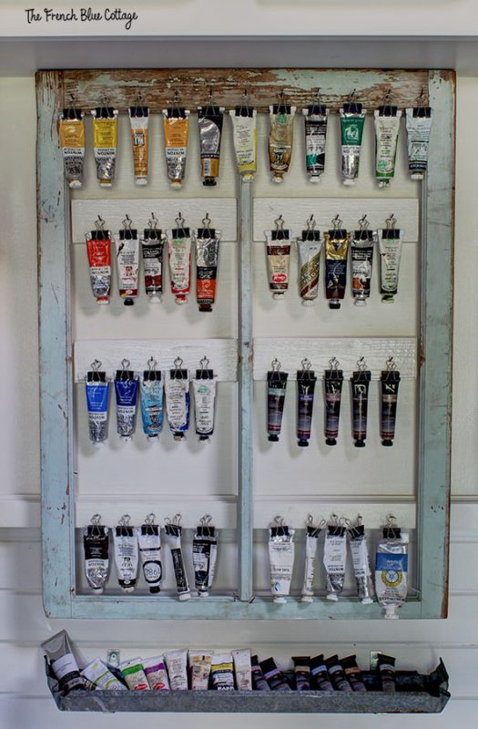 store and display oil paints on the wall with binder clips