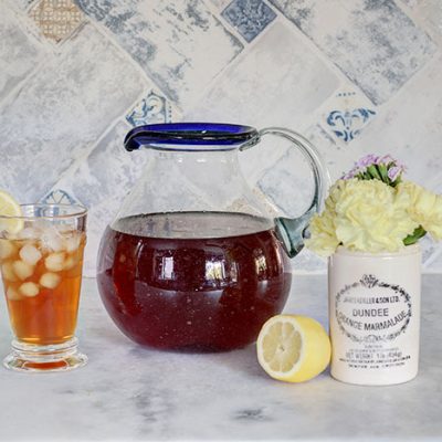 sweet tea in a pitcher with a lemon