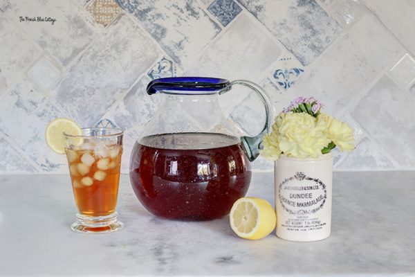 sweet tea in a pitcher with a lemon