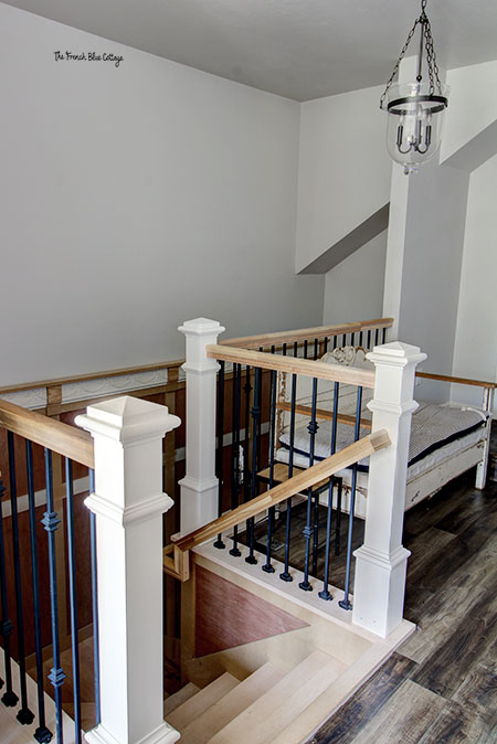 wrought iron railing and wood newel posts on new stairway