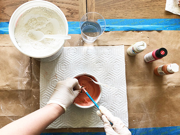 painting silk flowers with pink plaster of paris