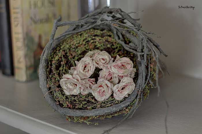 aged silk roses in a bird's nest