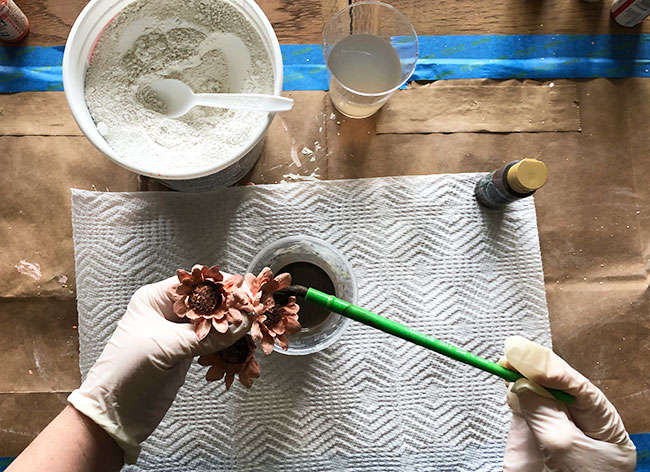 paint glaze onto plaster flowers