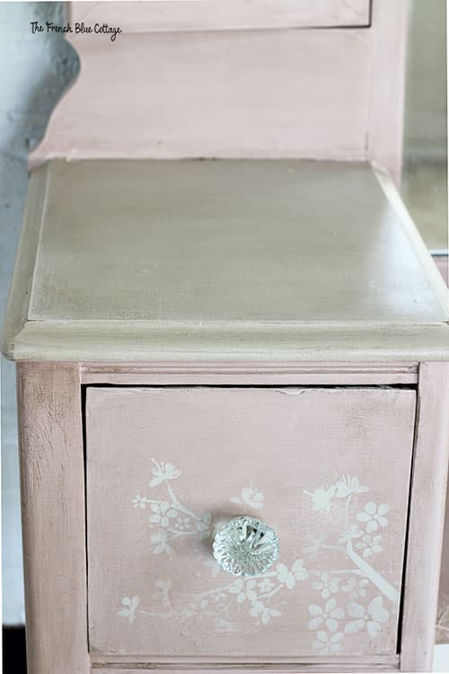 cherry blossom stencil on pink antique vanity drawers