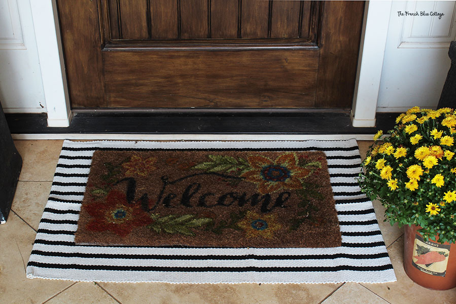 striped layered rug with fall doormat